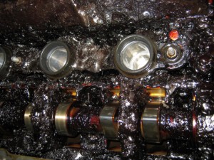 Close up of the engine, covered with the carbonised oil
