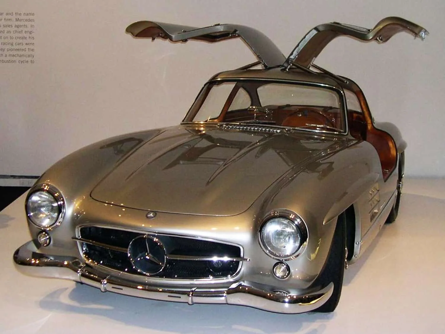 1955 Mercedes-Benz 300SL Gullwing Coupe. It has two door sedan that opens upwards.