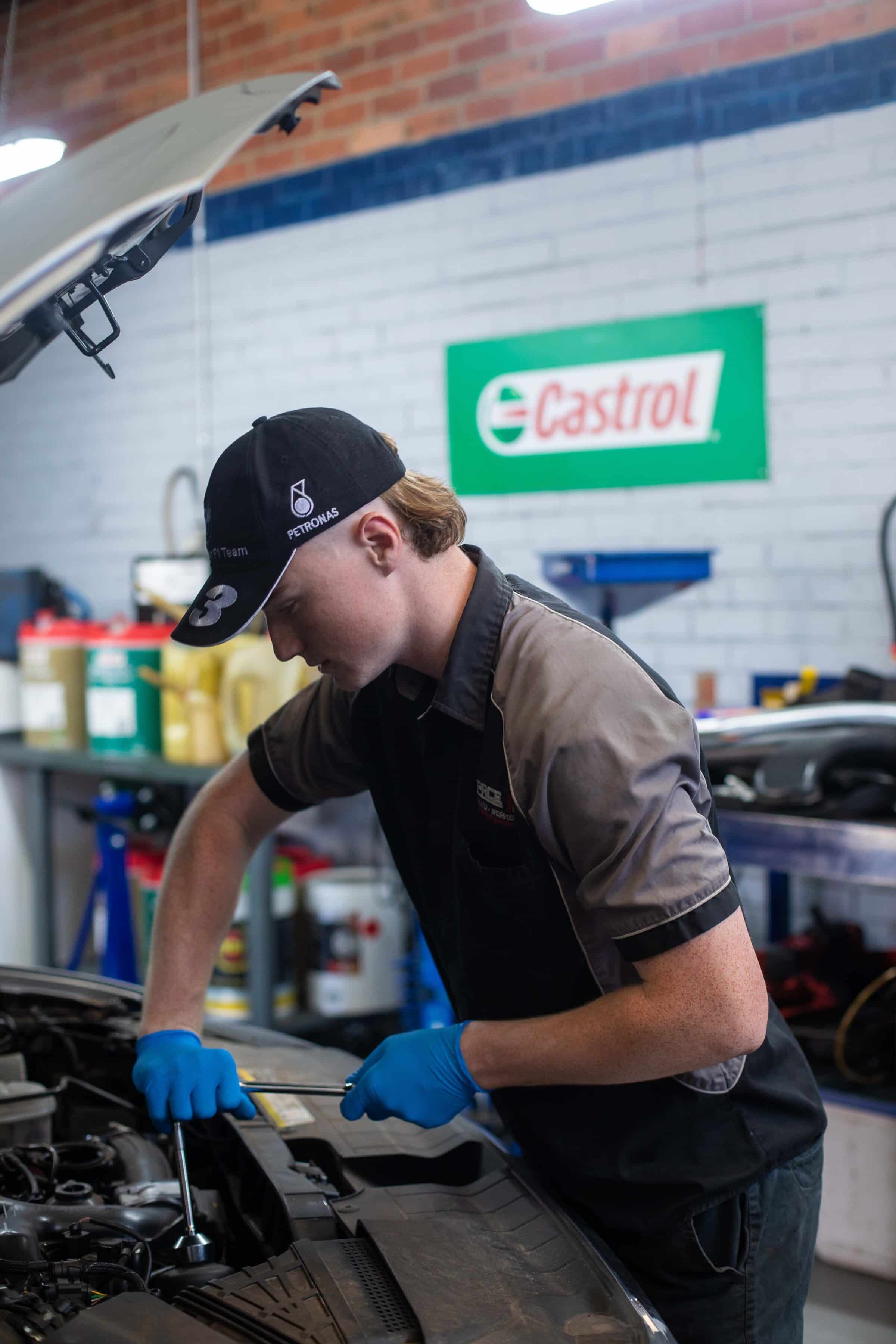 employee working on car engine