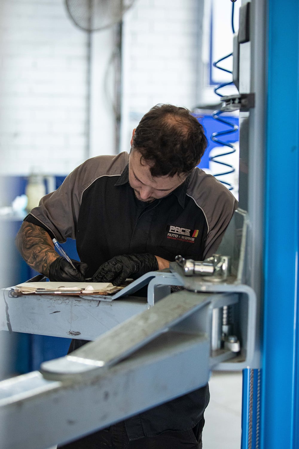 Specialist Mechanic Completing a Log Book Service