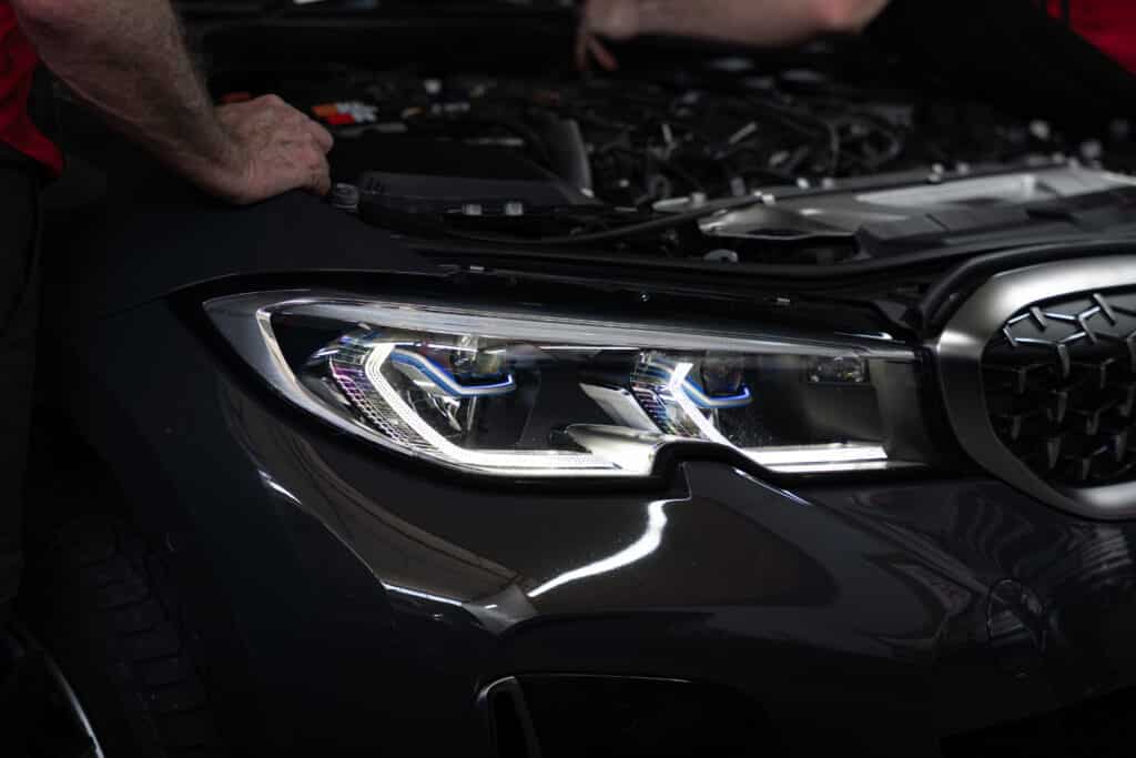 black car with bonnet popped open