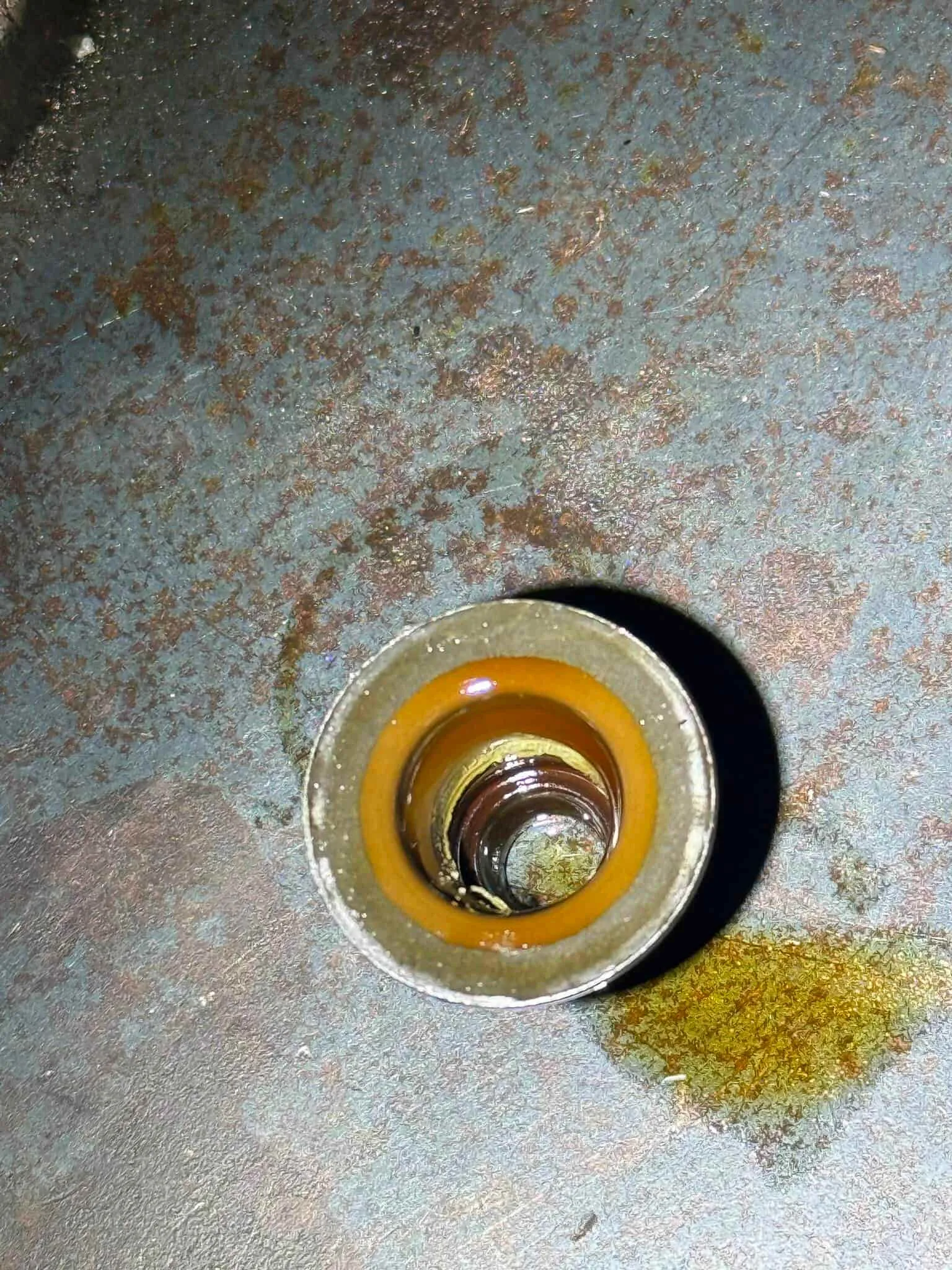 Macro photo of a hardened valve stem seal being replaced on a 2017 BMW X5M S63 engine at Pace Auto Werks