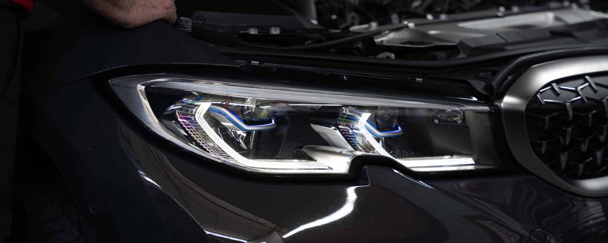 black car with bonnet popped open
